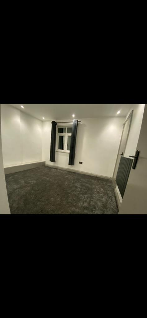 A spacious and bright double bedroom with moder...
