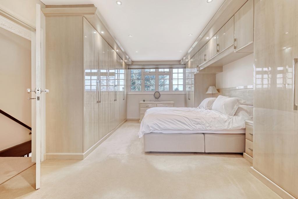 Master bedroom with fitted wardrobes and en-suite