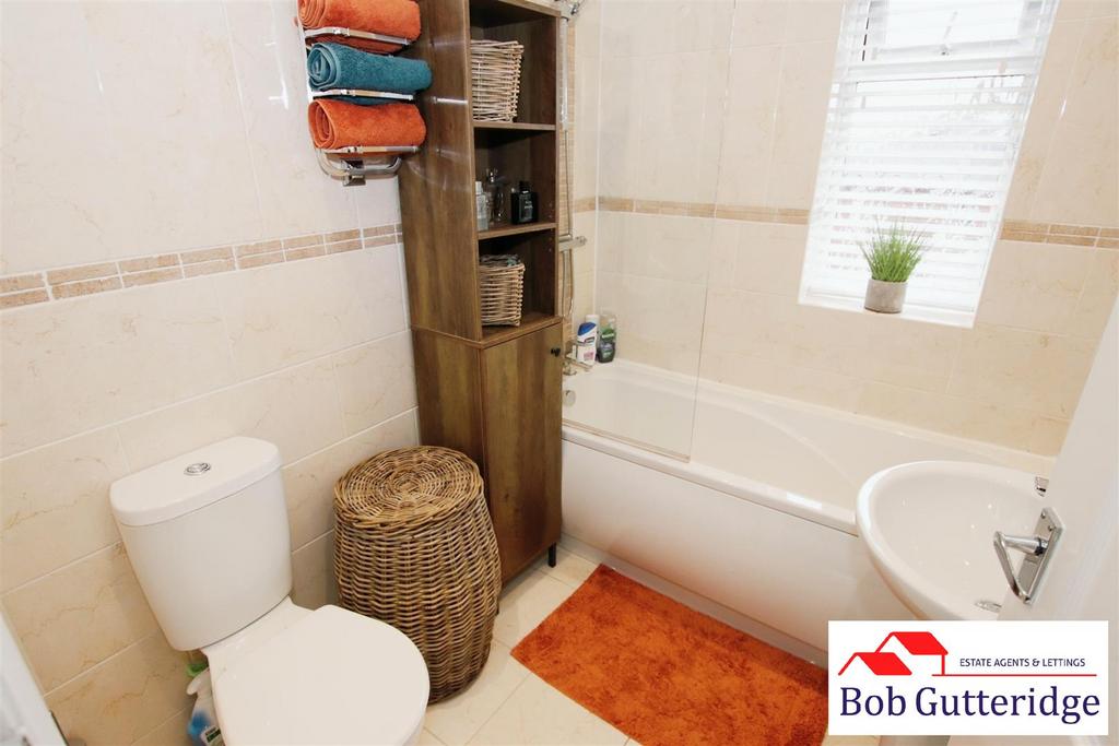 First floor fully tiled bathroom