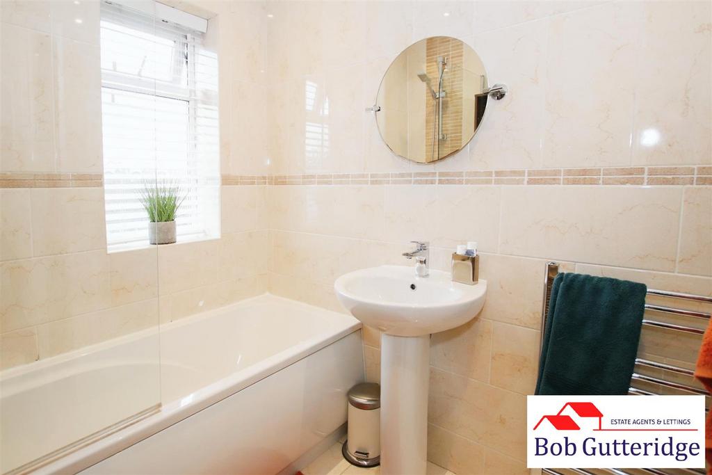First floor fully tiled bathroom