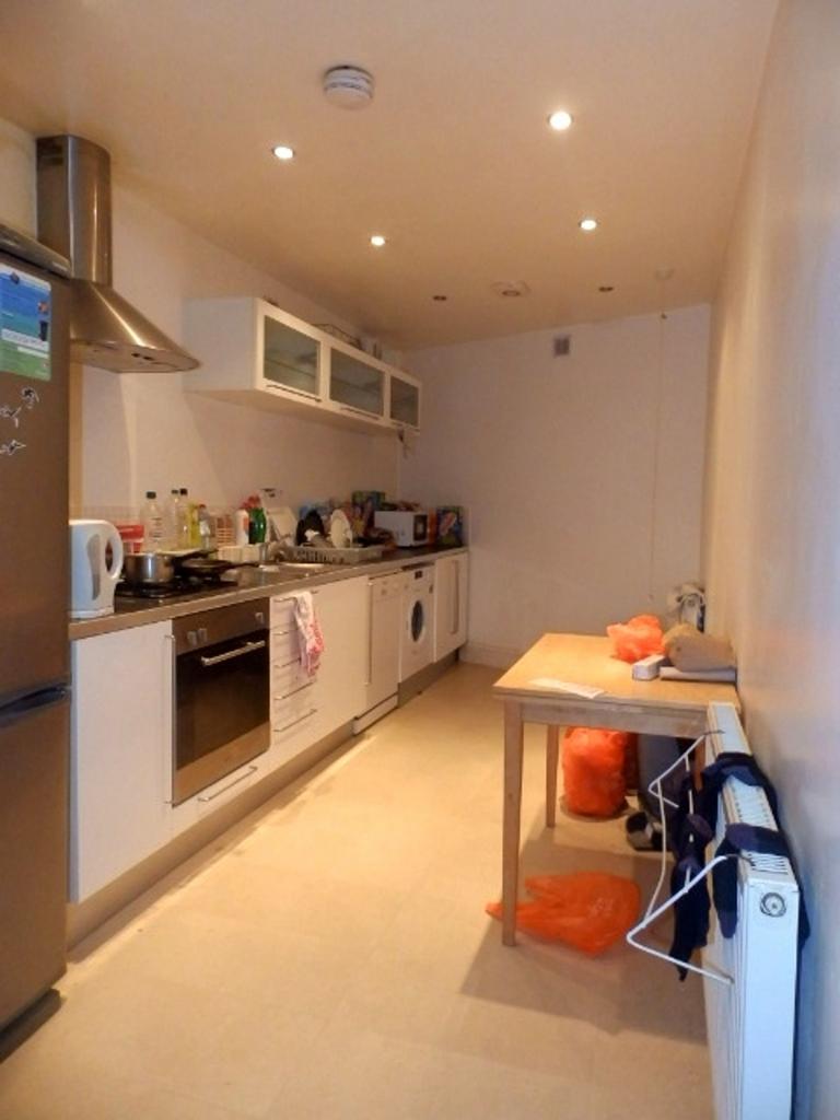 A spacious and well-lit kitchenette, perfect fo...