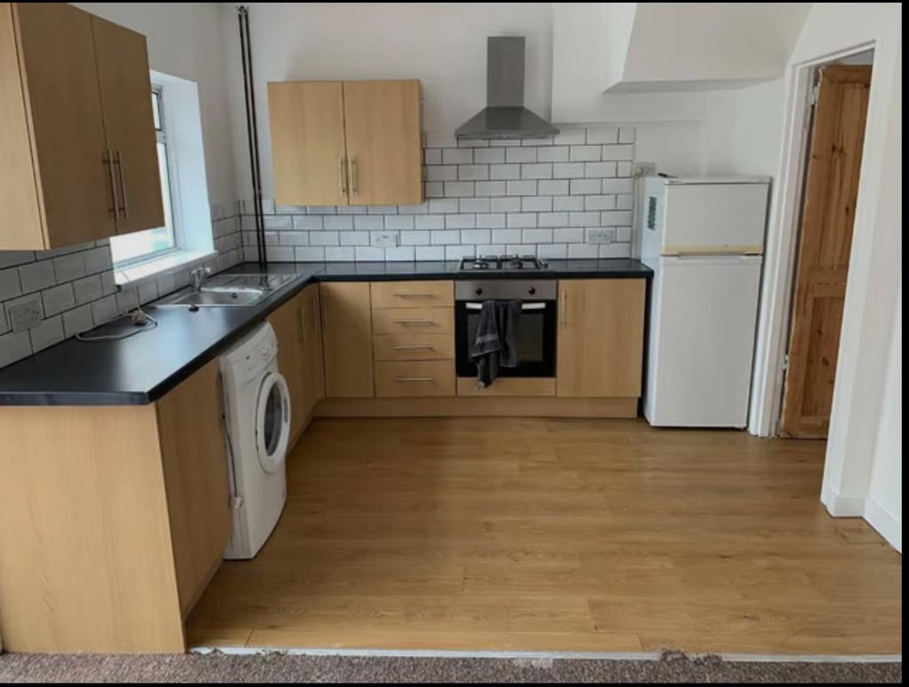 A modern and spacious kitchenette featuring amp...