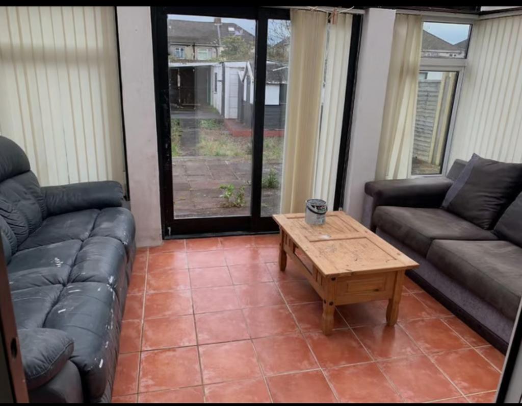 A spacious and inviting modern living room with...