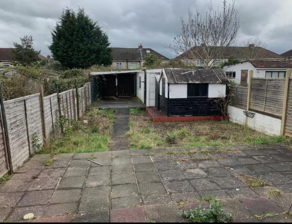 A spacious garden area with potential for outdo...