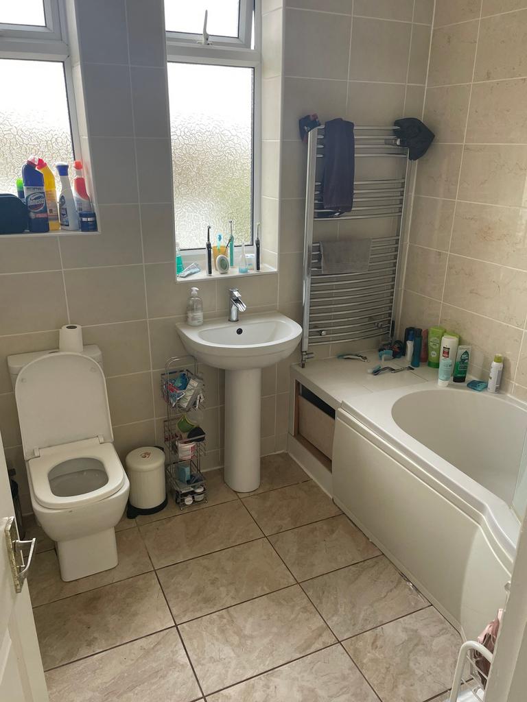 A bright and functional bathroom featuring a ba...