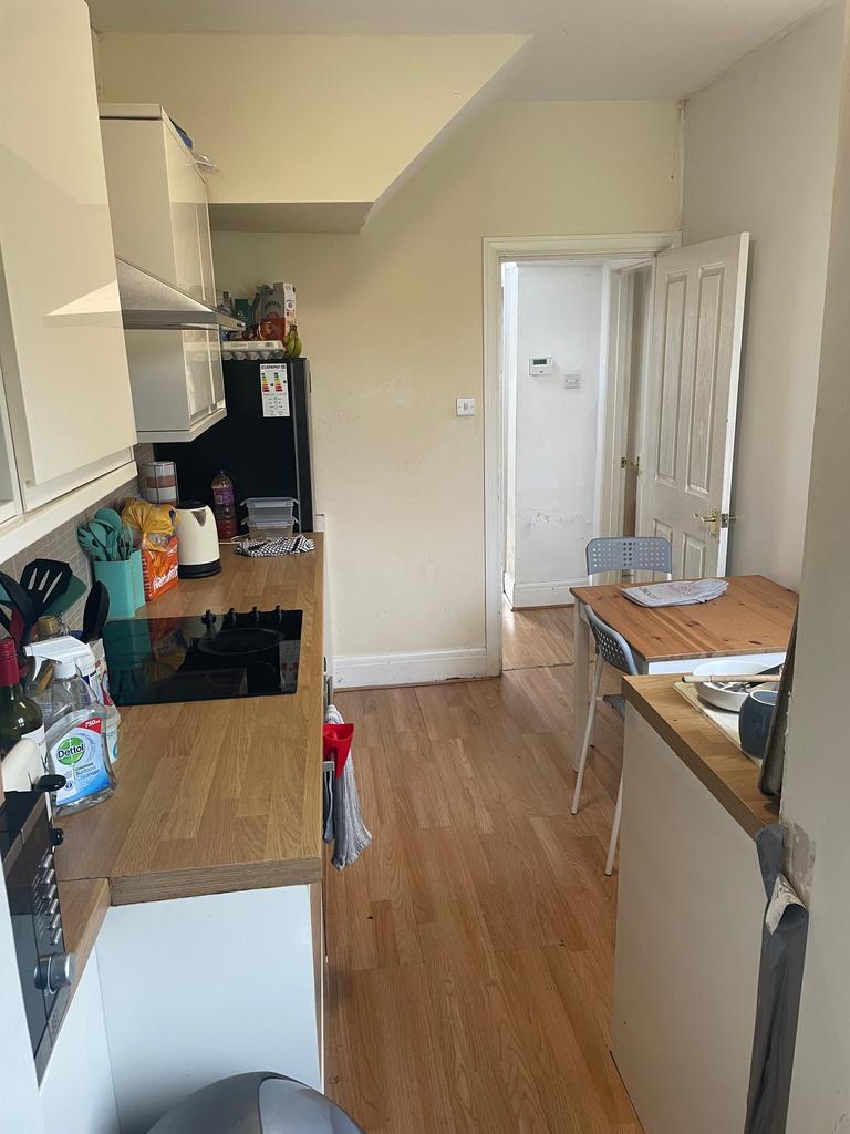 A bright and tidy kitchenette with modern appli...