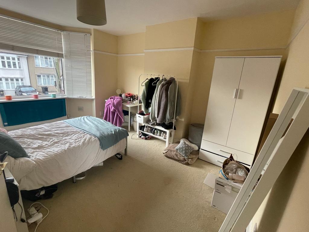 A spacious and bright double bedroom with ample...