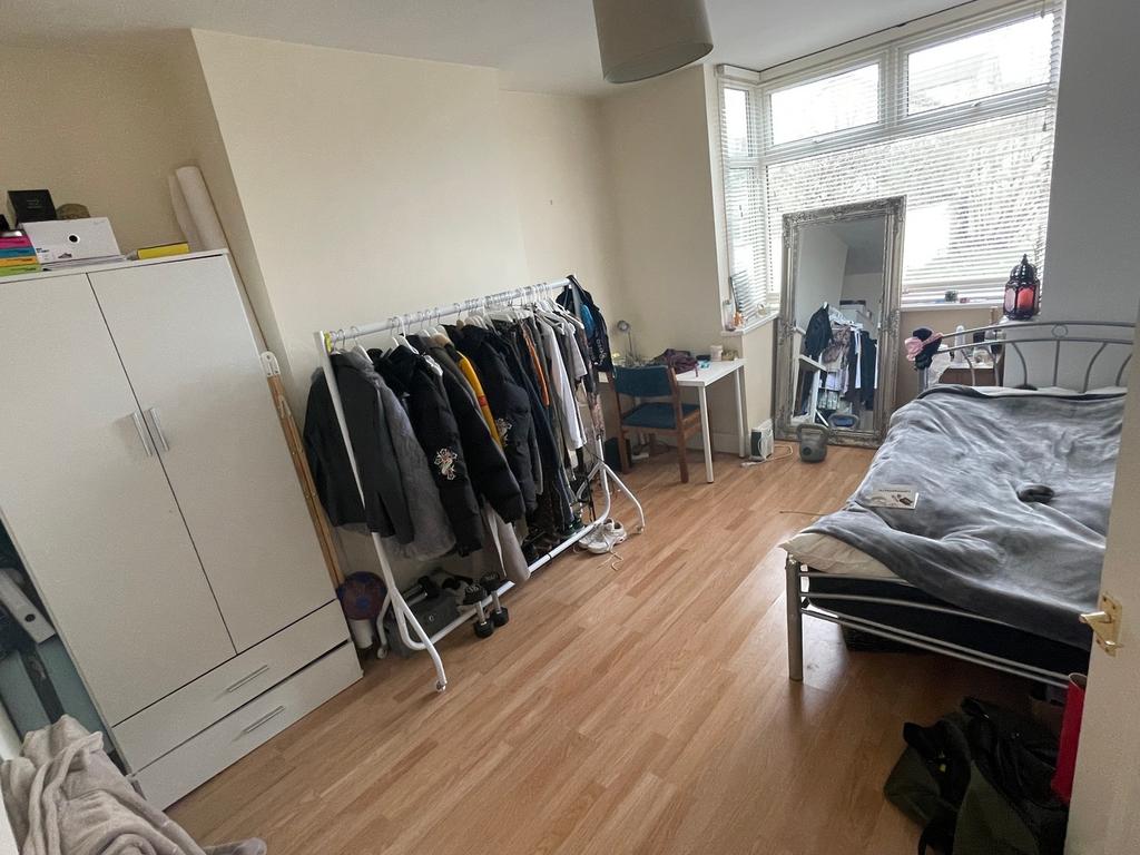 A bright and spacious double bedroom with ample...
