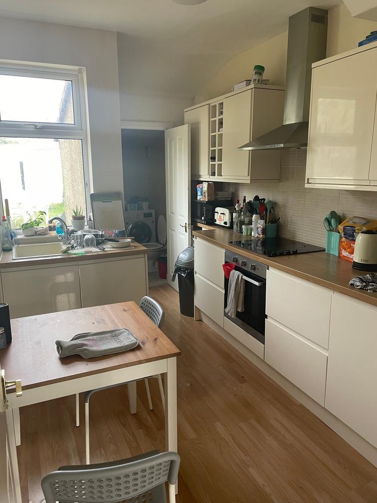 A bright and functional kitchen with modern fit...