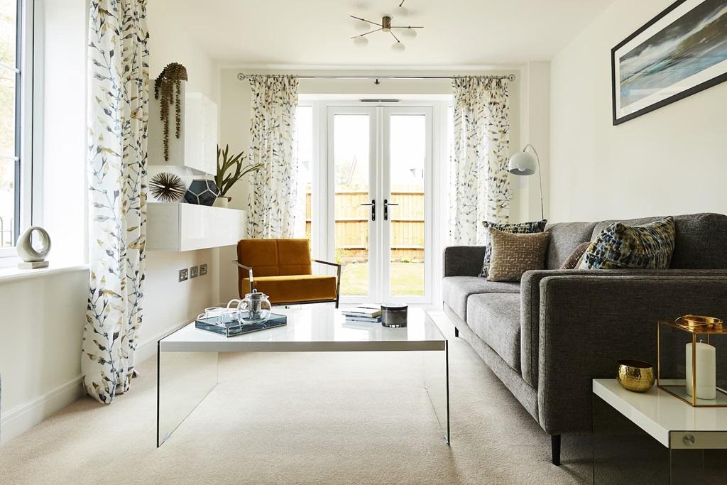French doors in the lounge allow access to the...