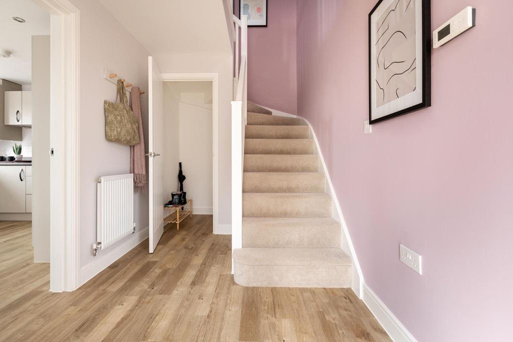 Central entrance hall has a convenient under...