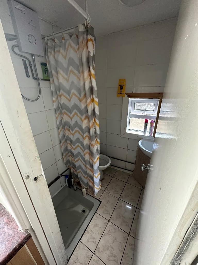 A functional bathroom with essential amenities,...