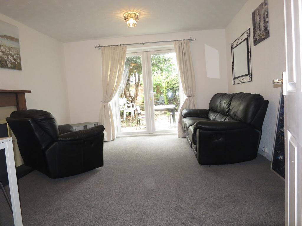 A spacious and inviting modern living room with...