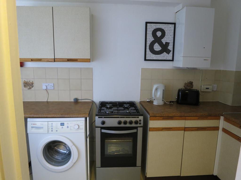 A tidy and functional kitchenette equipped with...