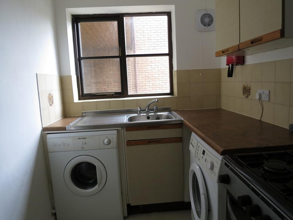A functional kitchenette with ample counter spa...