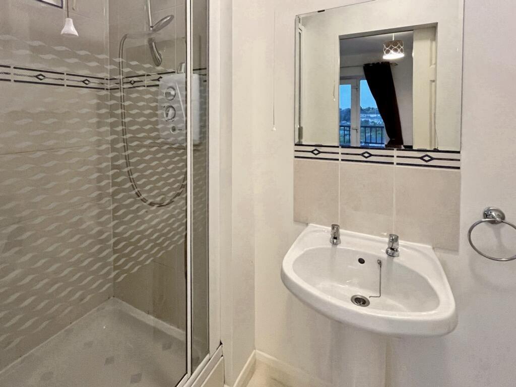 A modern and clean bathroom featuring a stylish...
