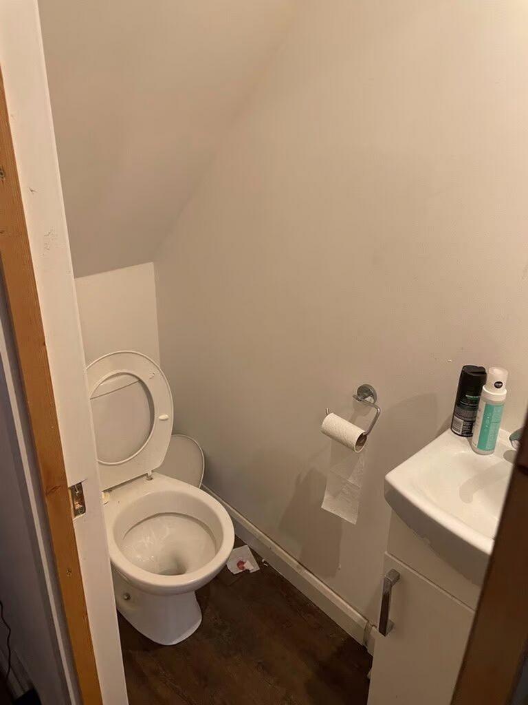 A tidy single toilet with essential amenities....