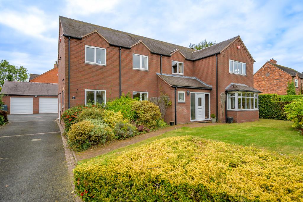 Front of Property with Garages