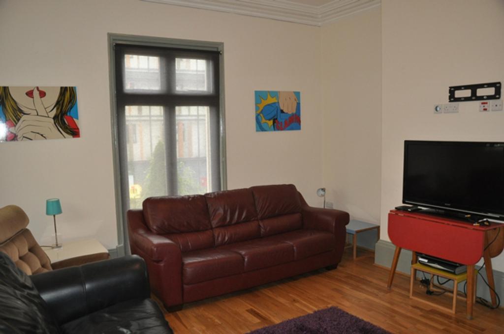 A spacious and well-lit modern living room perf...