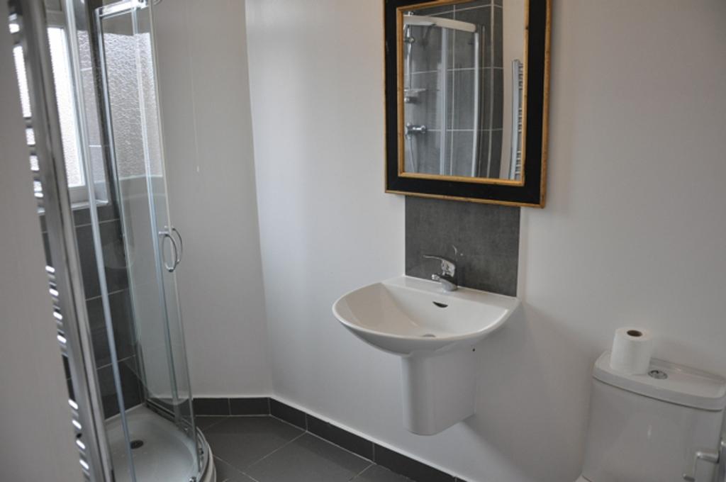 A modern and clean bathroom featuring a spaciou...