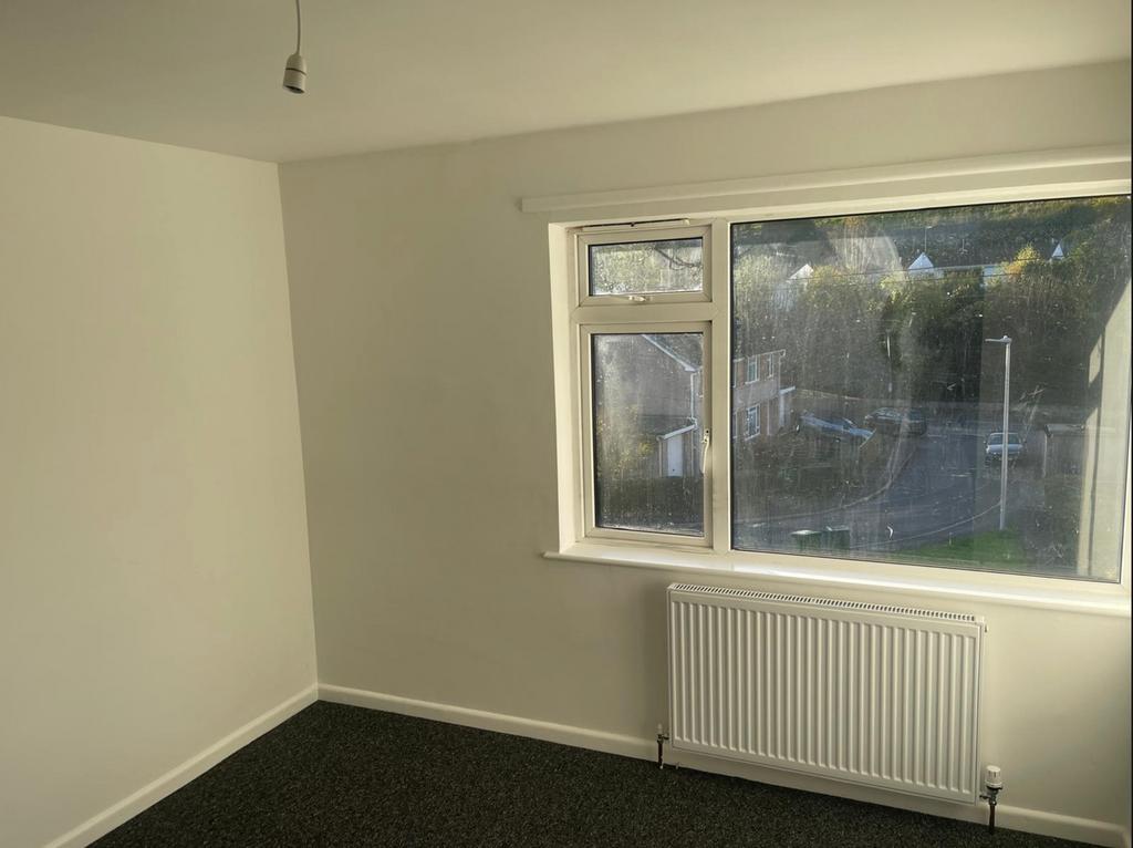 A bright and spacious double bedroom with large...