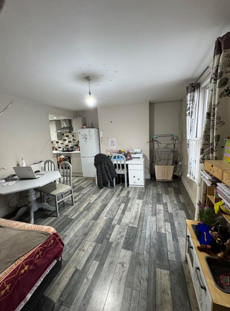A spacious and inviting living room with ample ...
