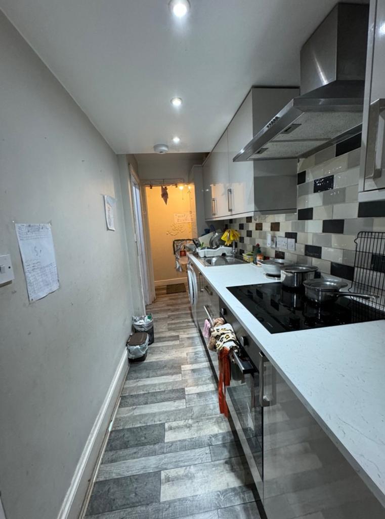 A functional kitchenette with modern appliances...