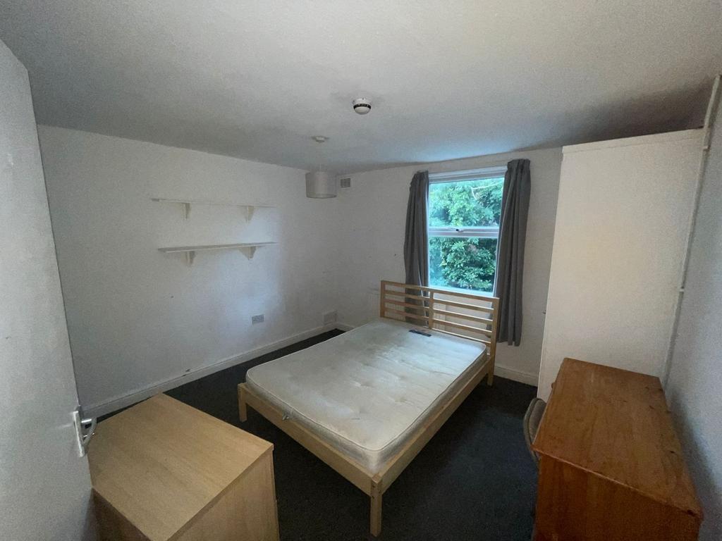 A spacious and bright double bedroom with ample...