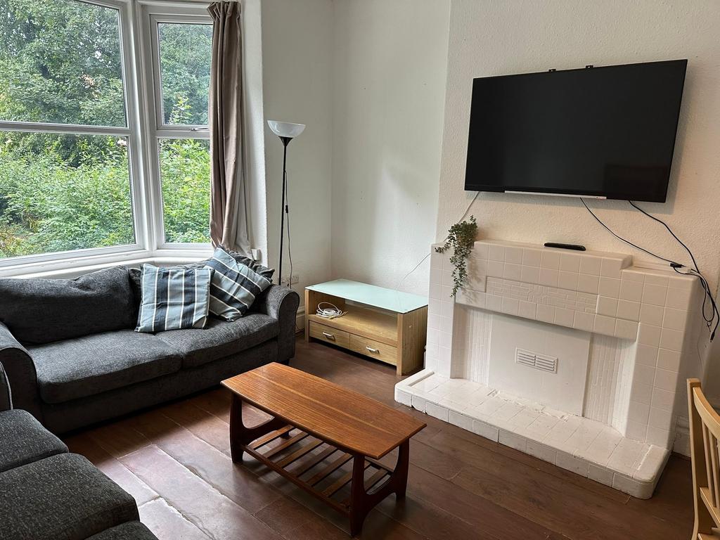 Bright and welcoming living room with large win...