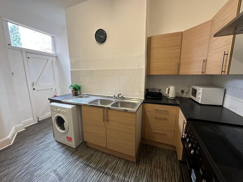 A well-organized kitchen featuring wooden cabin...