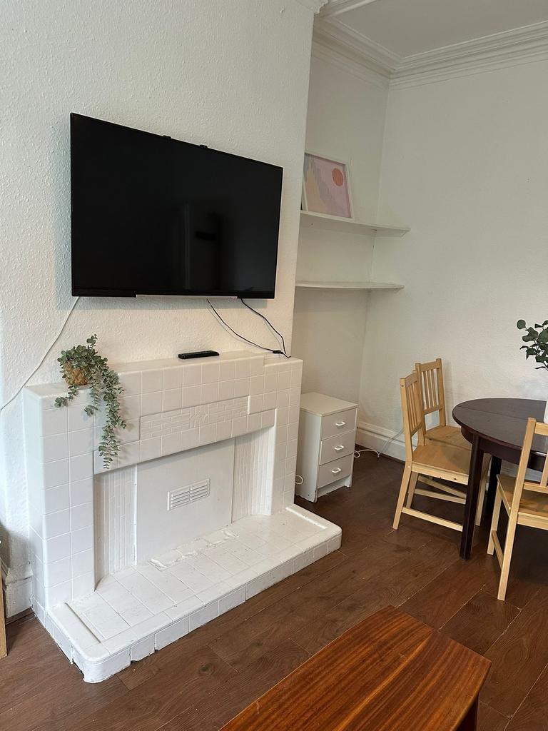 A cozy and well-maintained living room featurin...