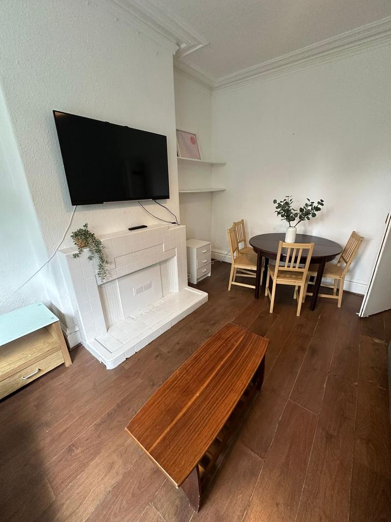 Bright and welcoming living room featuring a wa...