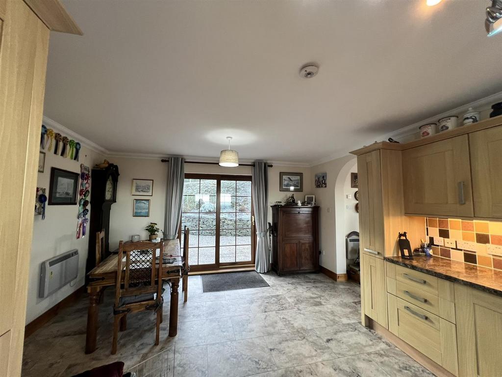 To rear entrance and patio doors