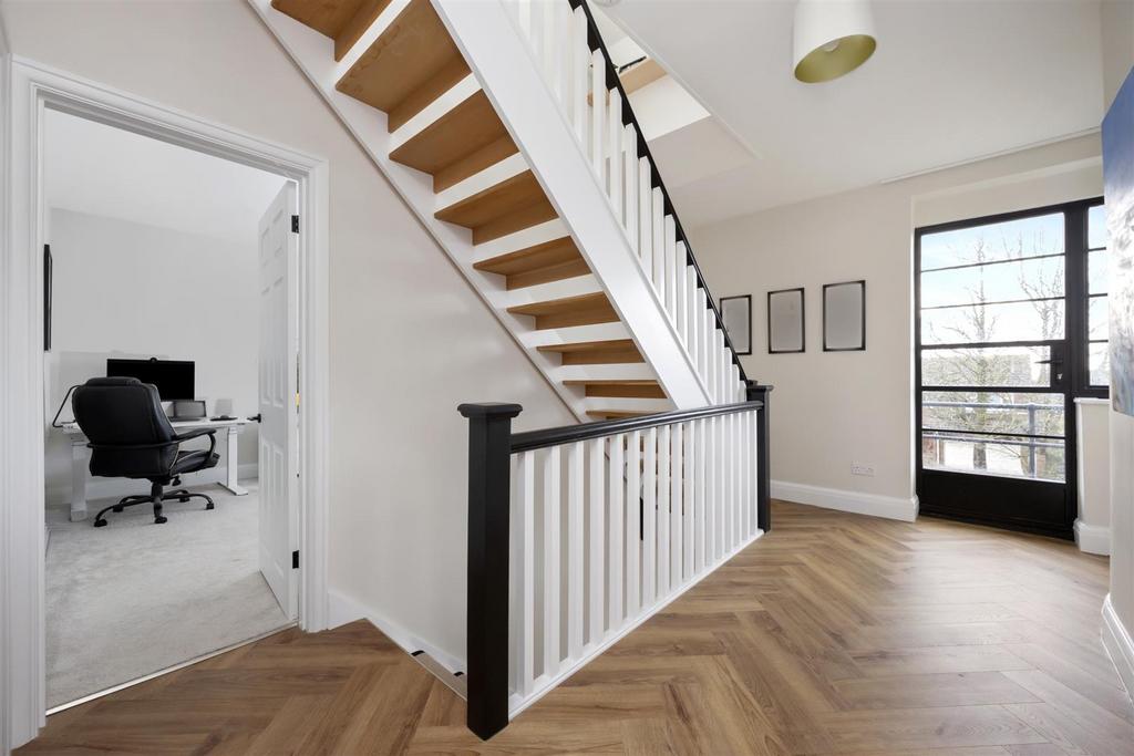 Stairs rising to Second Floor