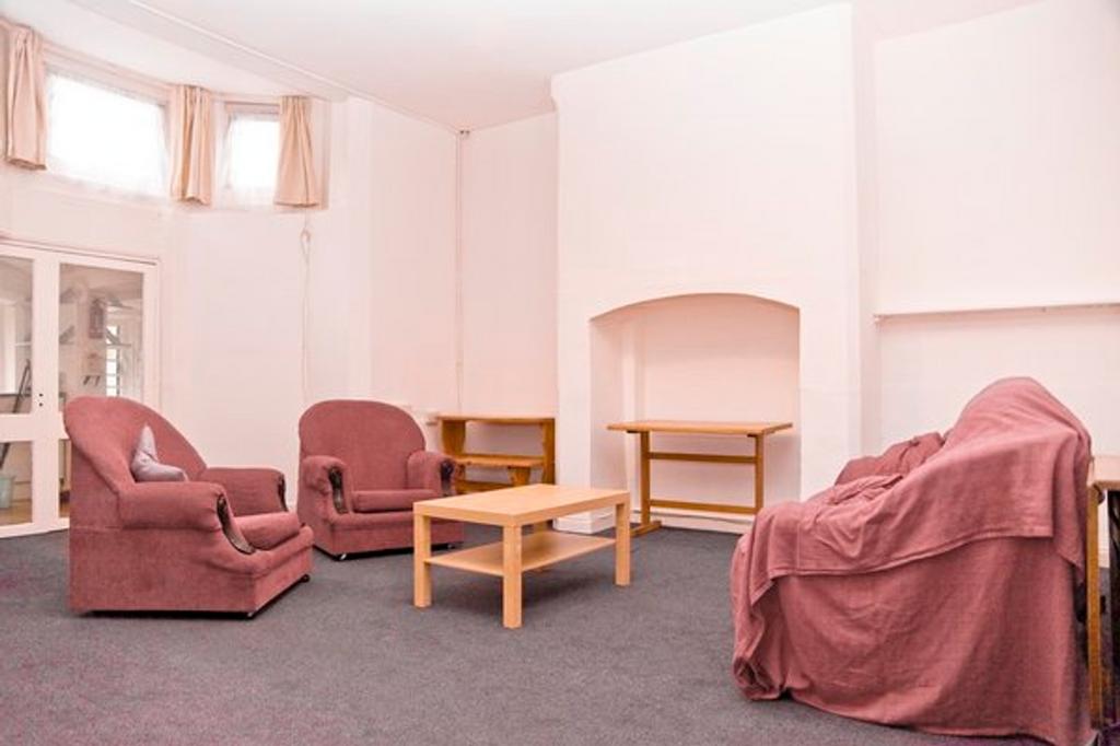 A spacious living room perfect for social gathe...