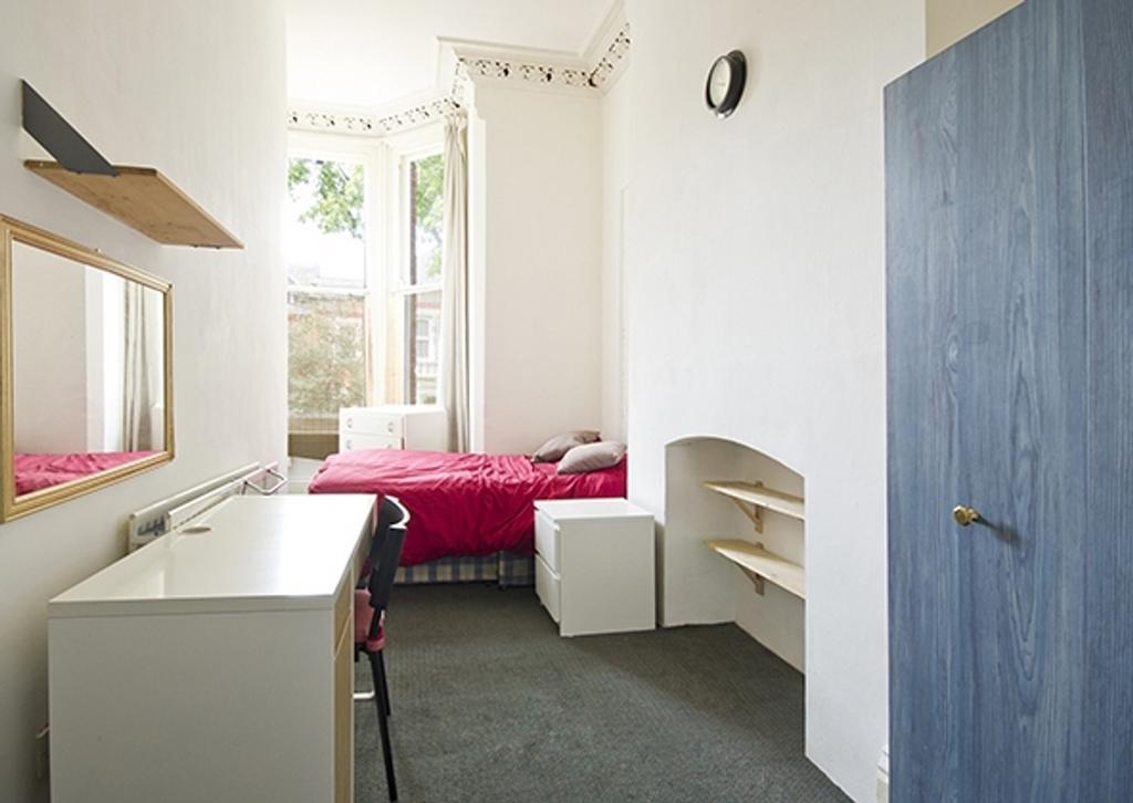A bright and inviting double bedroom, featuring...
