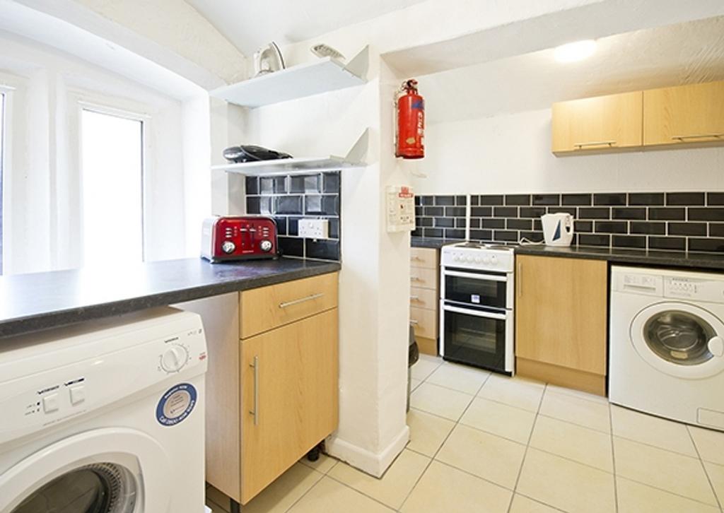 A bright and modern kitchenette featuring ample...