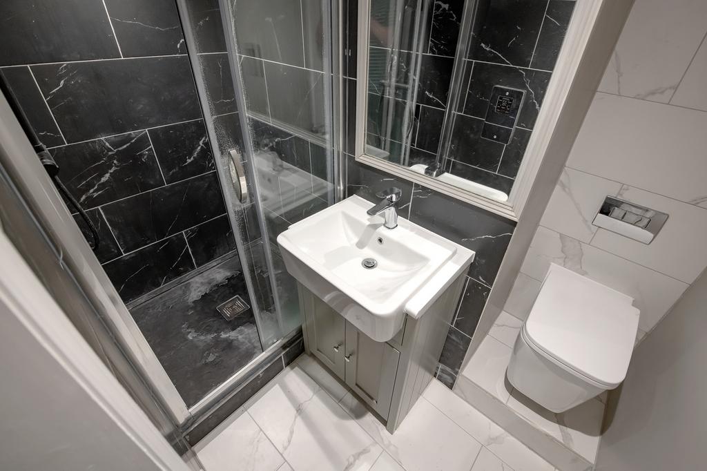 A stylish bathroom featuring modern fixtures an...