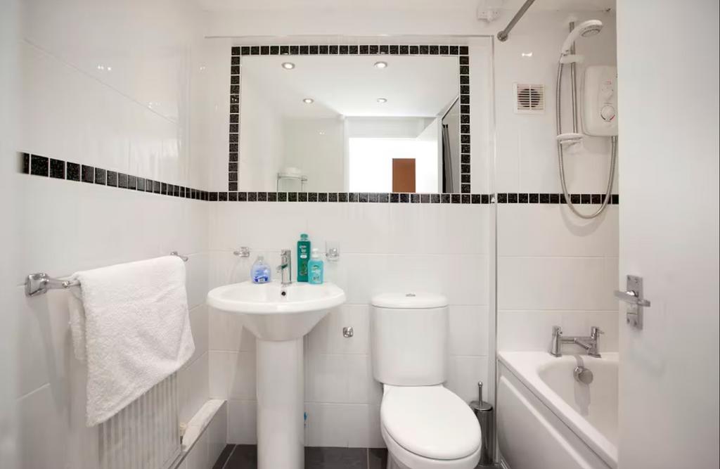 A bright and modern bathroom featuring a clean ...