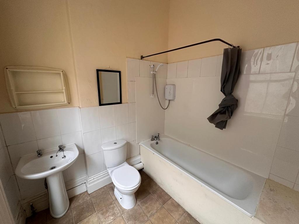 Simple, functional bathroom with a full-size ba...