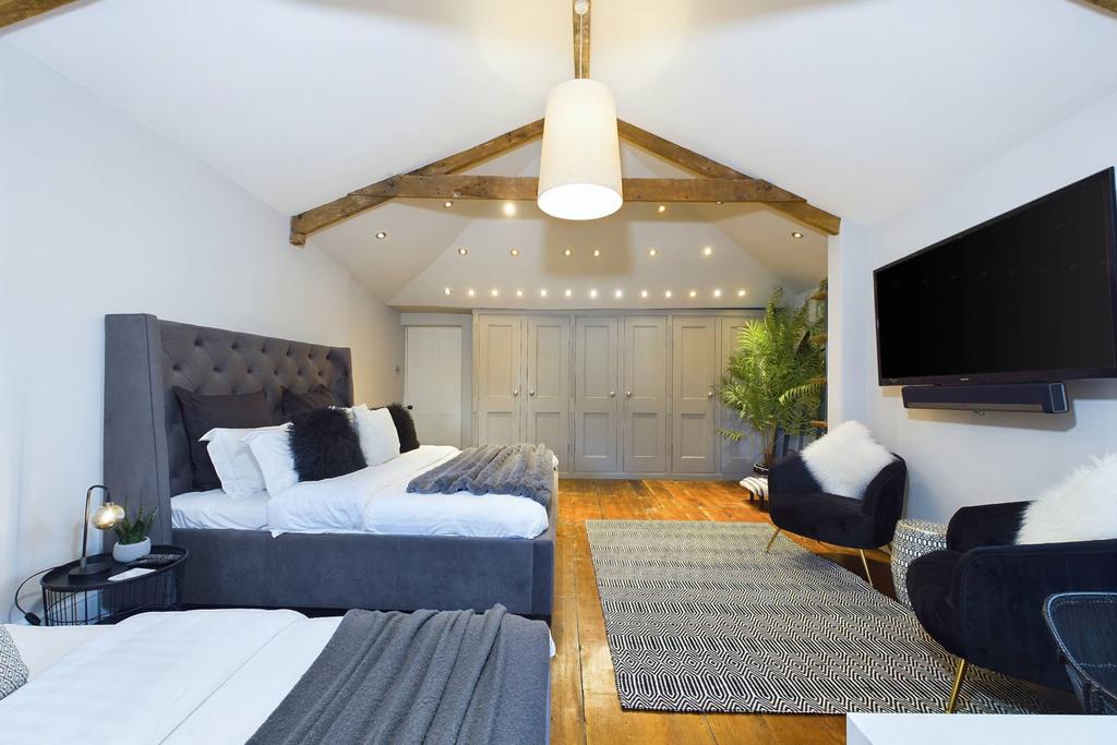 Bedroom five with vaulted ceiling