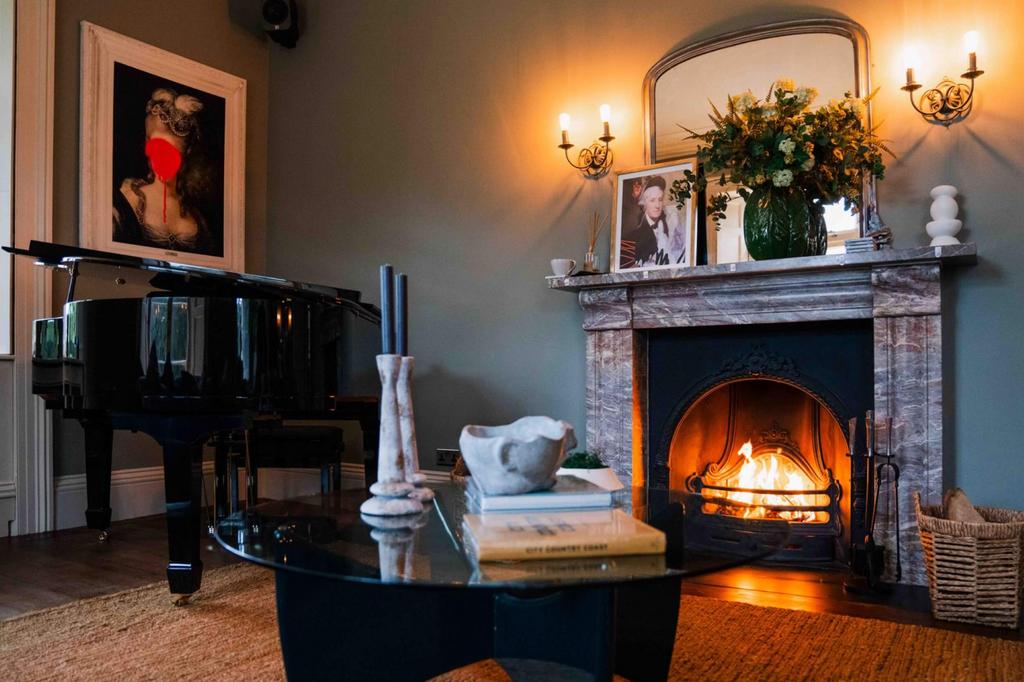 Drawing room fireplace with roaring fire