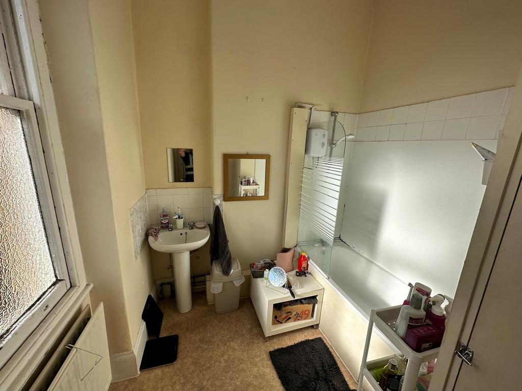 A bright and tidy bathroom featuring modern fix...