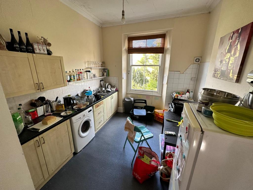 A cozy kitchen with ample space for cooking and...