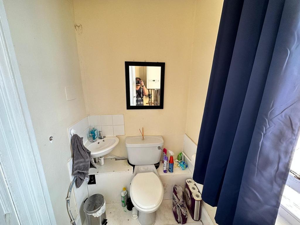 A functional bathroom with essential amenities,...