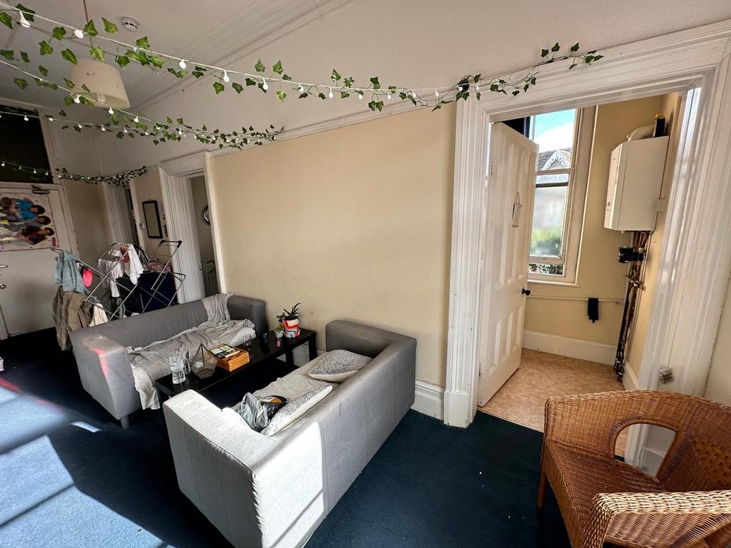 A spacious and inviting living room with ample ...