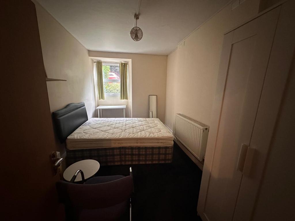 Neatly presented double bedroom with a comforta...