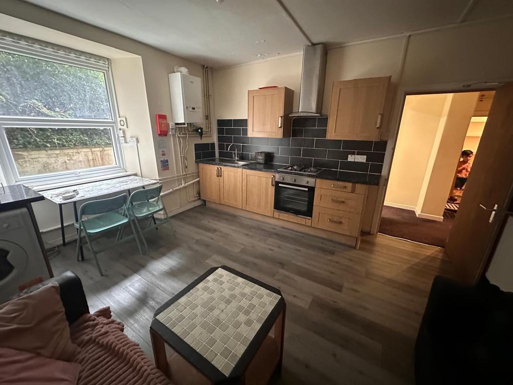 Bright, modern kitchen with fitted wooden cabin...