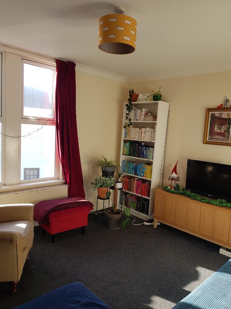 A bright and inviting large modern living room,...