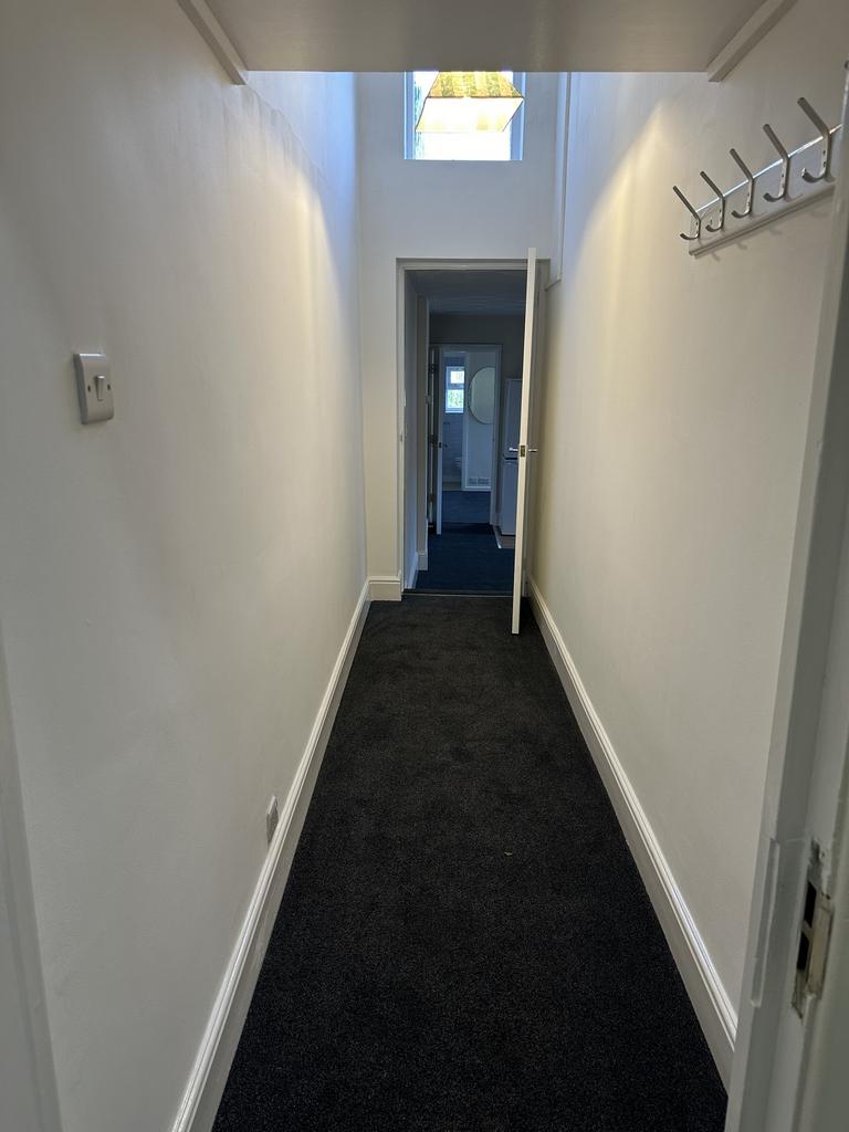 A spacious and well-maintained hallway with mod...